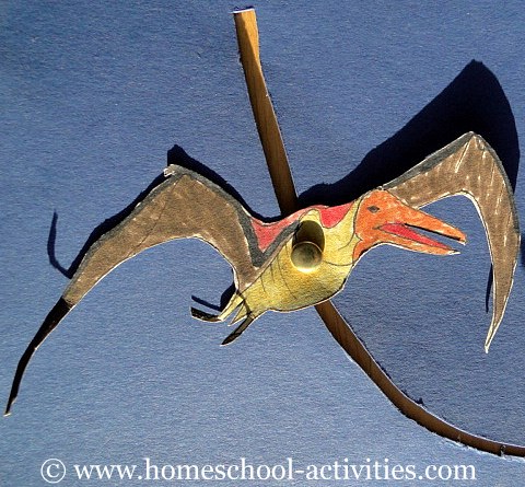 pterosaur flying with a paper fastener