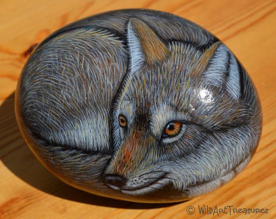 Wolf painted rock