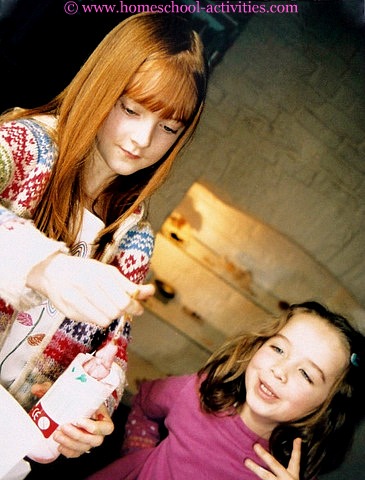 two girls pulling out slime