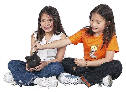 two girls with piggy bank